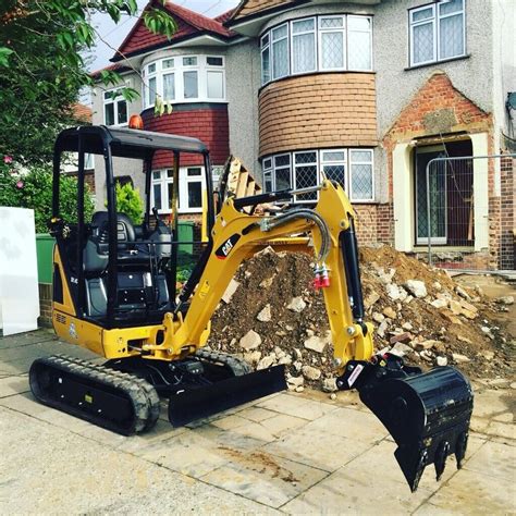 man with mini digger|mini digger rental near me.